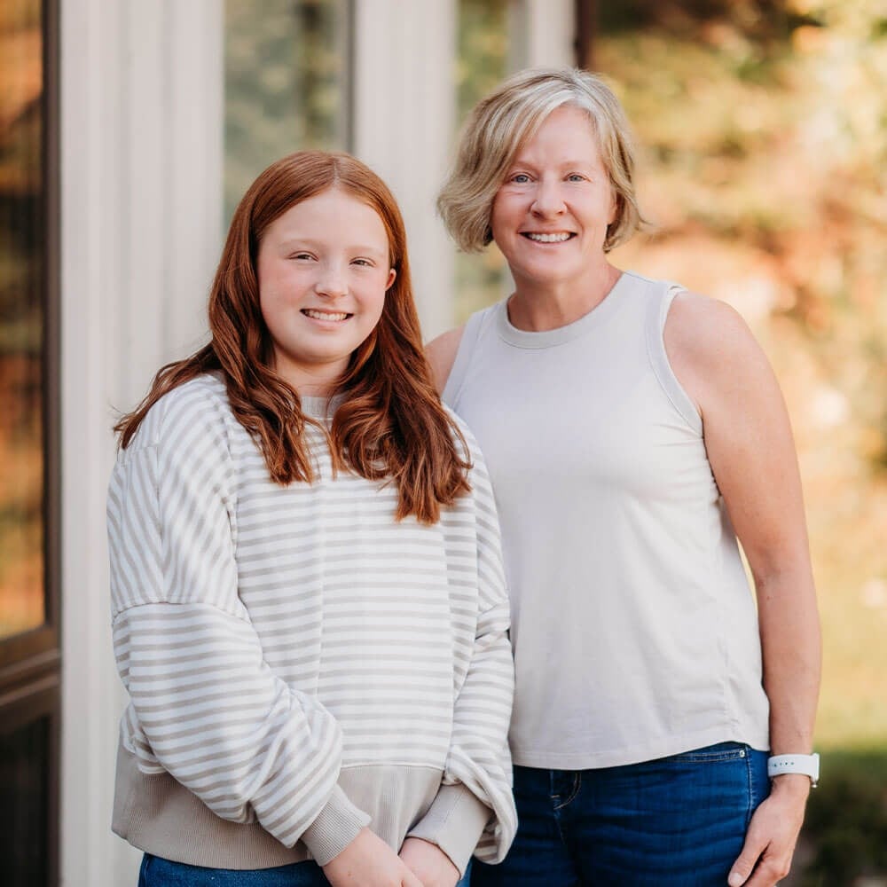 Smiling Adult Woman and daughter